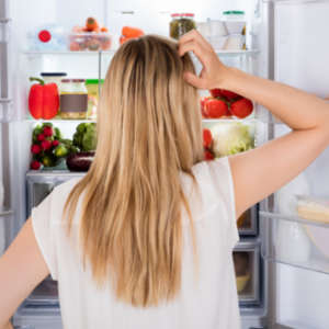 woman looking in the fridge