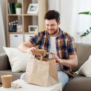 man eating takeout