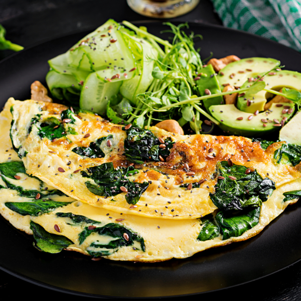 vegetable omelet with avocado slices