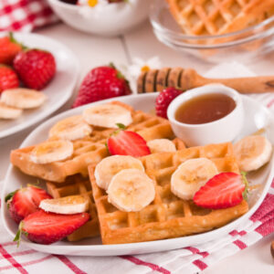 waffle topped with strawberries and bananas