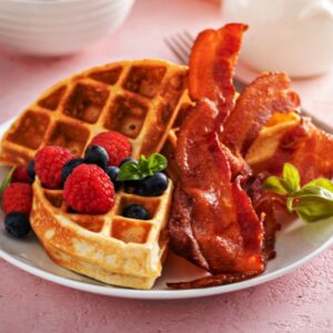 Belgian waffles with crispy bacon and fresh berries