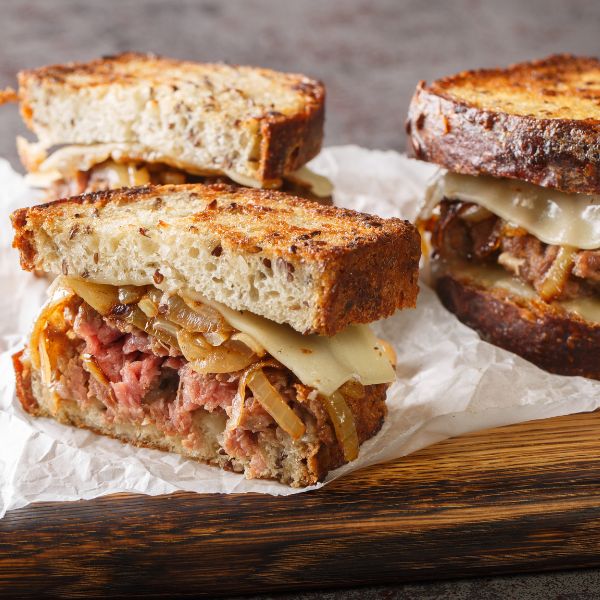 beef patty melt sandwich on rye bread