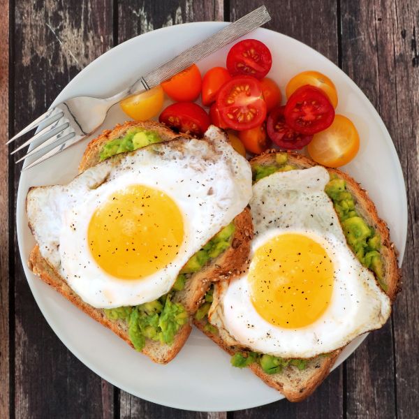 fried eggs on avocado toast