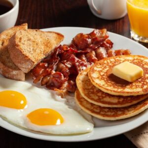 eggs, pancakes, bacon and toast