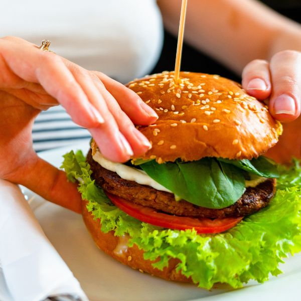 woman eating veggie burger